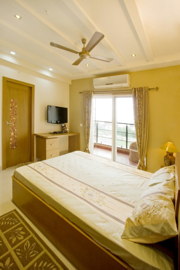 Golden Themed Bedroom Space With White False Ceiling by Yogendra Garg Bedroom Contemporary | Interior Design Photos & Ideas