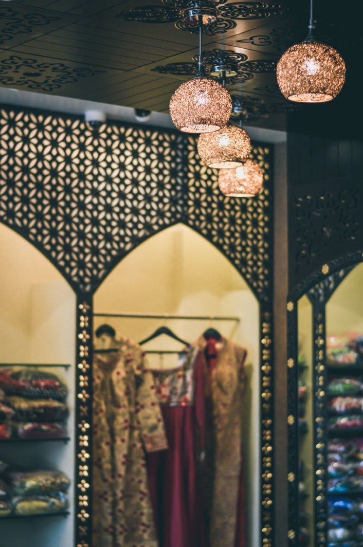Ethnic Showroom With Pendant String Lights by Nirav Gor Contemporary | Interior Design Photos & Ideas
