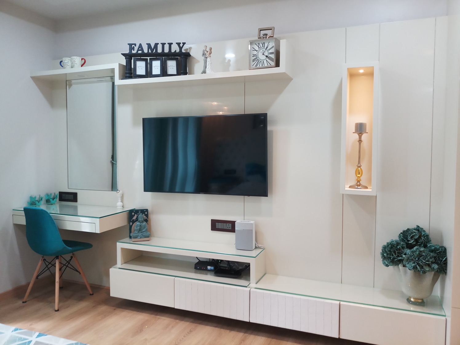 TV Unit Hinged to White Glossy Wall and with Dressing
