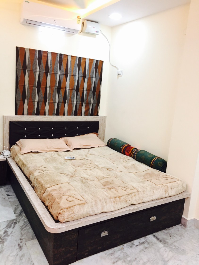 Let's Rest:Queen size bed with Indian style bolster and dark upholstered headboard by Chaitanya Challa Bedroom Contemporary | Interior Design Photos & Ideas
