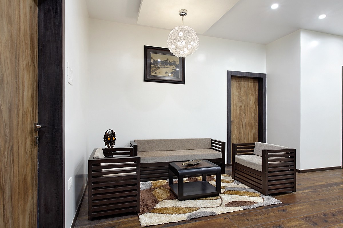 Living Room With Hanging Designer Light And Wooden Flooring by Prashant Ghosh Living-room Modern | Interior Design Photos & Ideas