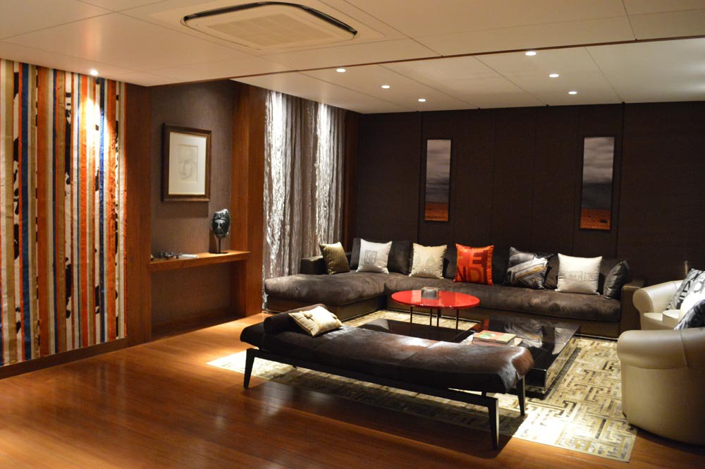 Living room with L shaped sectional sofa and dark black lounge illuminated by LED ceiling lights by Gocosy.com Dining-room Modern | Interior Design Photos & Ideas