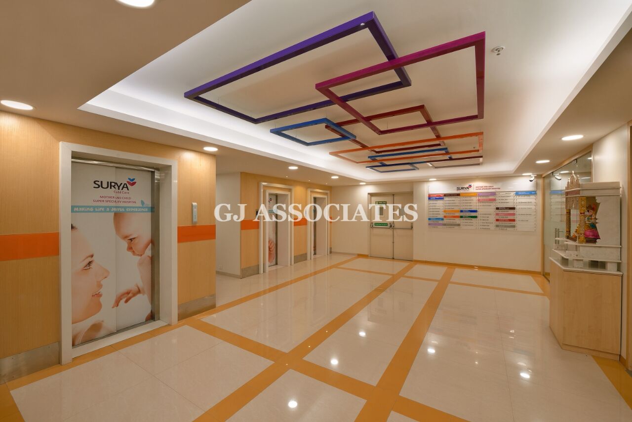 Well-lit Hospital Hallway With White and Beige Marble Floor by Gaurang Jawle Modern | Interior Design Photos & Ideas