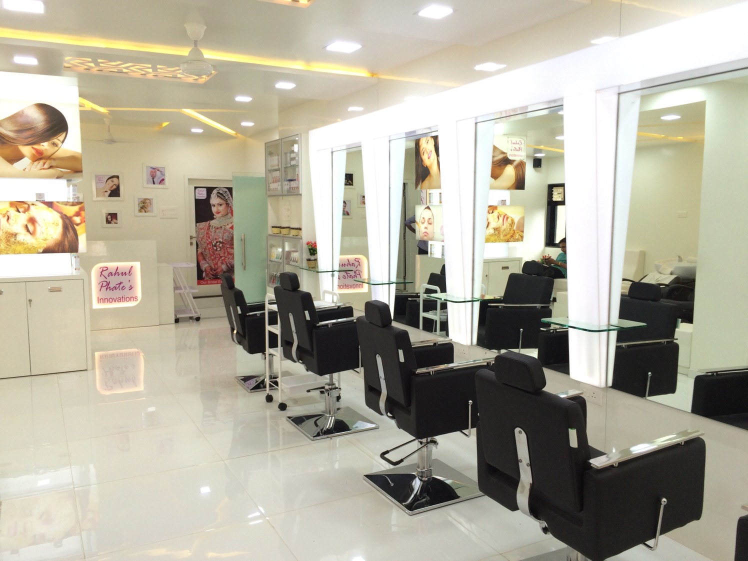 Salon design with black leather chairs by Ameya Pingle Contemporary | Interior Design Photos & Ideas