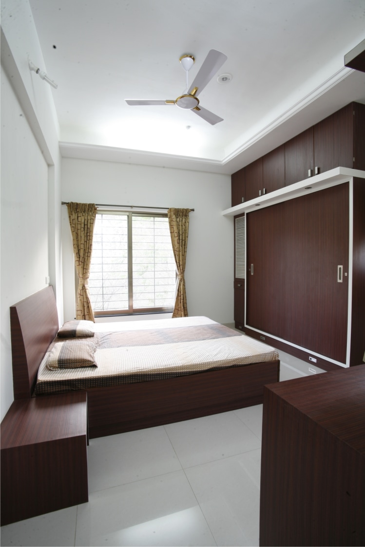 Ebony Wooden Bed and Wardrobe With Sliding Door by Rajas Joshi Bedroom Modern | Interior Design Photos & Ideas