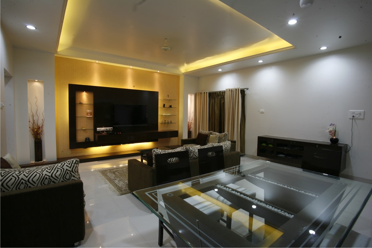 Living Room With Golden Accent Ceiling Light and Ebony mid Century Modern Sofas by Rajas Joshi Living-room Modern | Interior Design Photos & Ideas