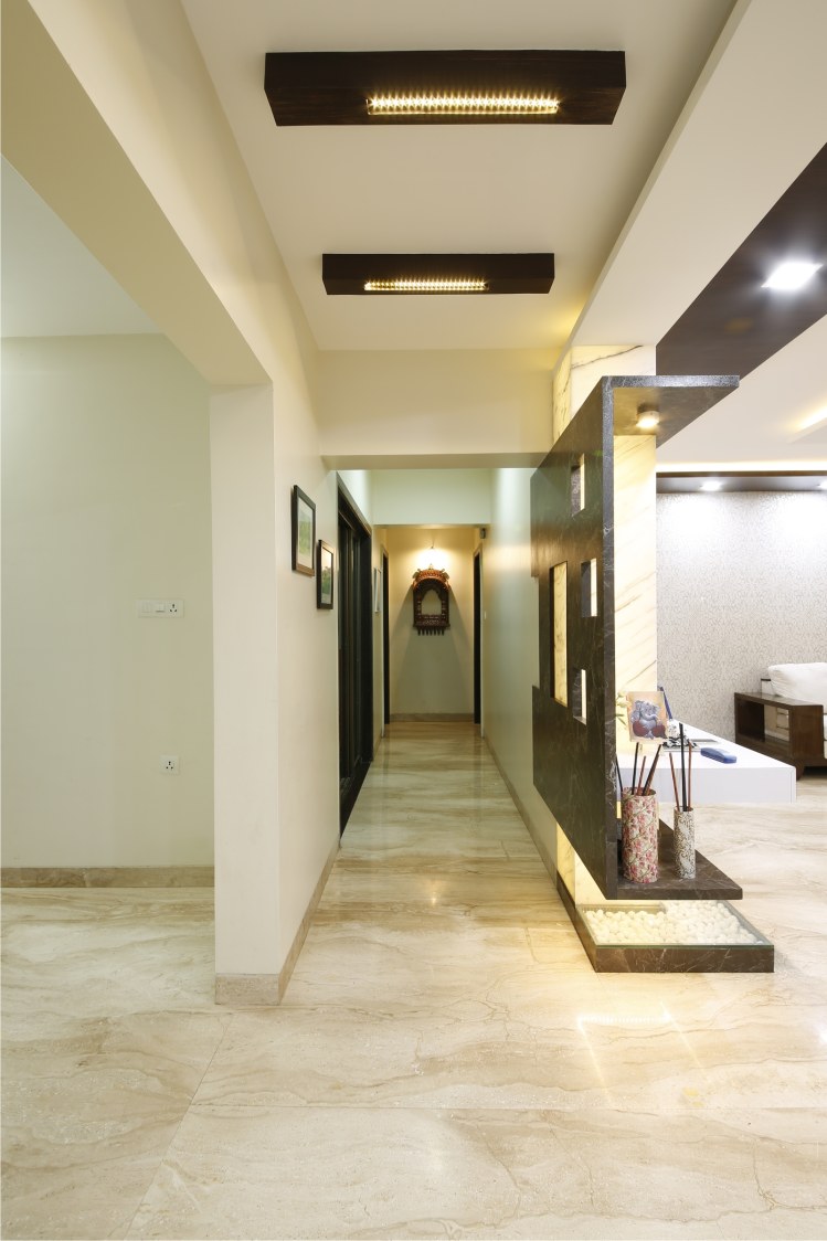 Hallway With Beige Italian Marble flooring and Golden Accent Light by Rajas Joshi Indoor-spaces Modern | Interior Design Photos & Ideas