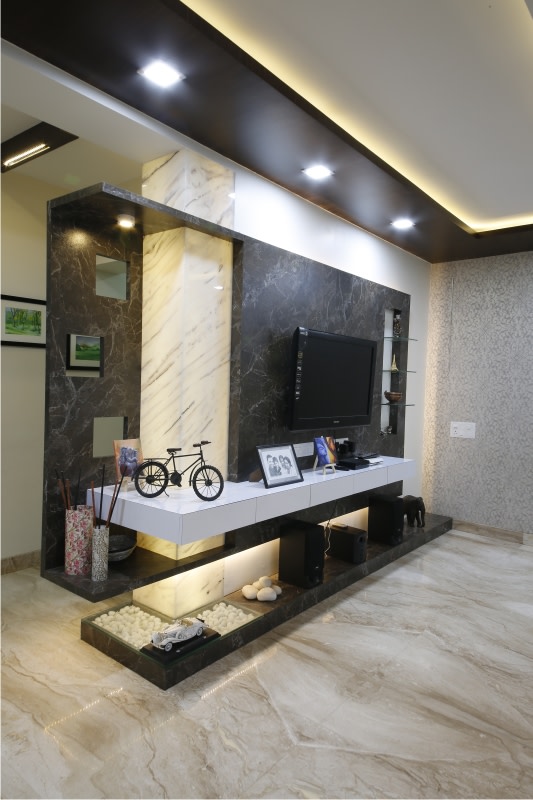Black Travertine Marble TV Cabinet With Golden Accent Ceiling Light by Rajas Joshi Living-room Modern | Interior Design Photos & Ideas