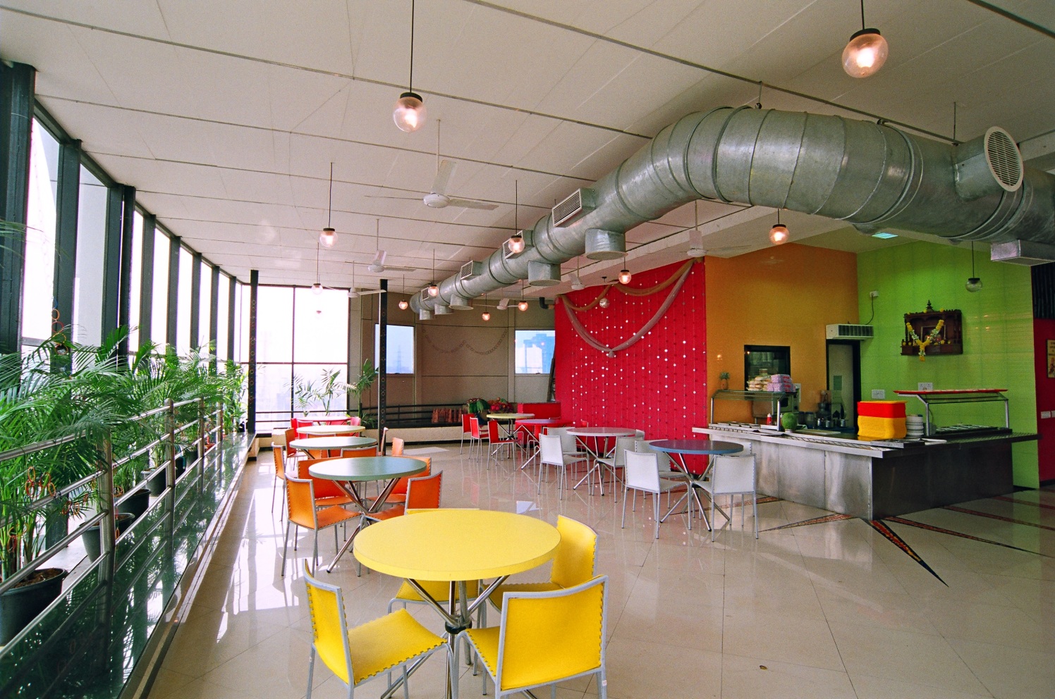 Cafe With Round Table And Colorful Chairs by Sanjiv Kedia Contemporary | Interior Design Photos & Ideas