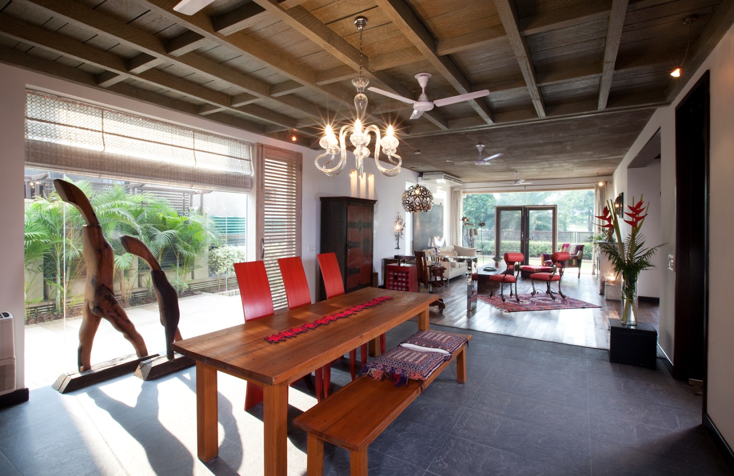Dining room With Wooden Table And Red Chairs by narayan moorthy Dining-room Contemporary | Interior Design Photos & Ideas