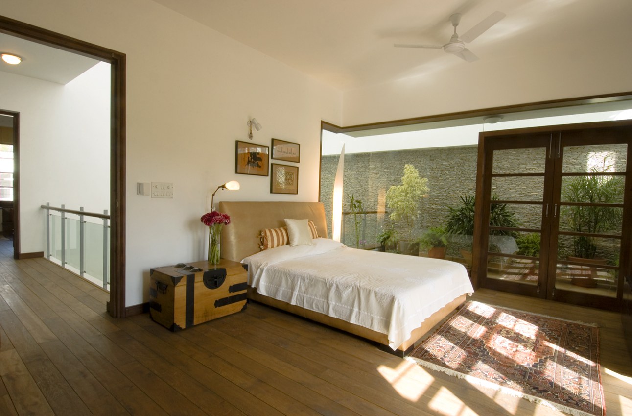 Bedroom With Wooden Flooring And Wooden Cabinet by narayan moorthy Bedroom Contemporary | Interior Design Photos & Ideas