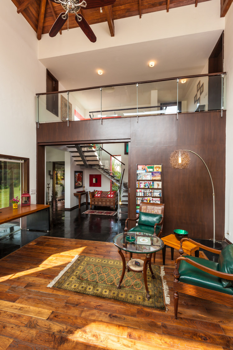 Living Room With Leather Seaweed Green Chair And Glass Top Table by narayan moorthy Living-room Traditional | Interior Design Photos & Ideas