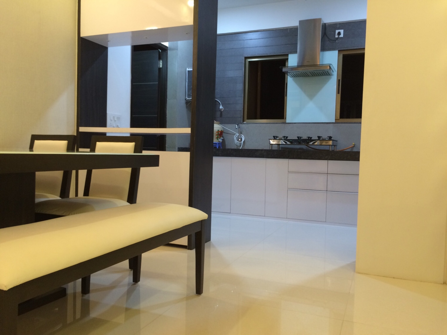 Dinning space with marble flooring and white furniture by Vatsal Hadvani Modular-kitchen Modern | Interior Design Photos & Ideas