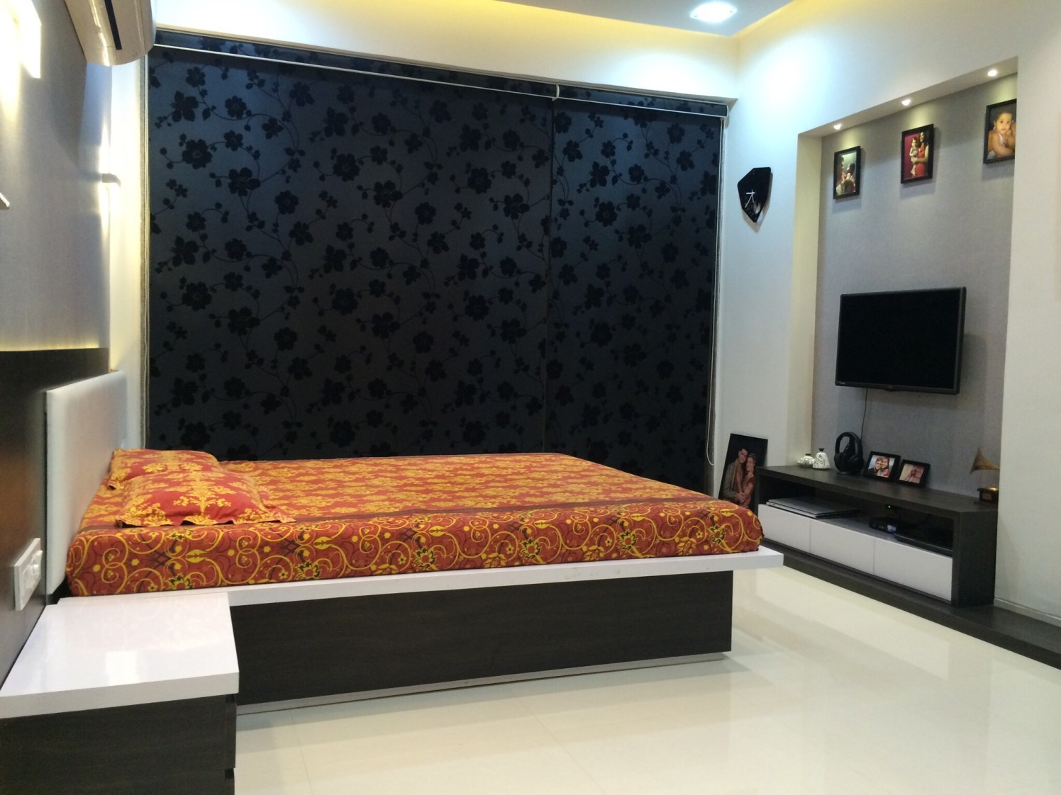 Marble flooring bedroom with false ceiling and TV unit with display unit by Vatsal Hadvani Bedroom Contemporary | Interior Design Photos & Ideas
