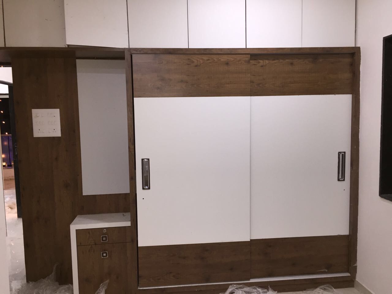 Walnut Brown and White Shaded Wardrobe With Sliding Door by Shravan Hendre Bedroom Modern | Interior Design Photos & Ideas