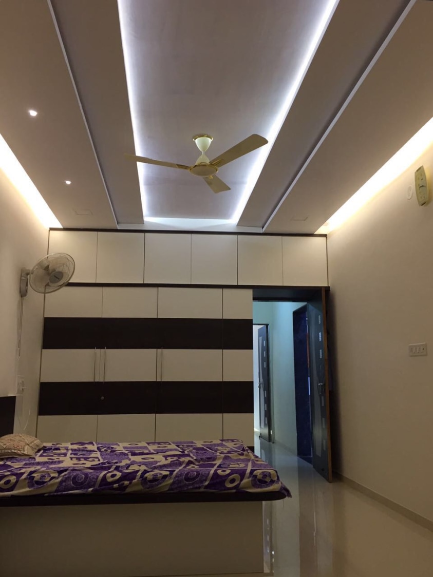 Well-Lit Bedroom With Golden Accent Perimeter Lighting by Shravan Hendre Bedroom Modern | Interior Design Photos & Ideas