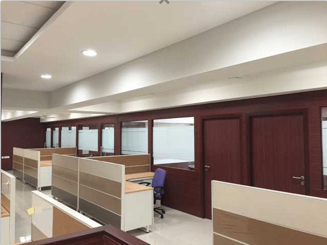 Common Cubicle area with Side meeting rooms by Roshan Ashta