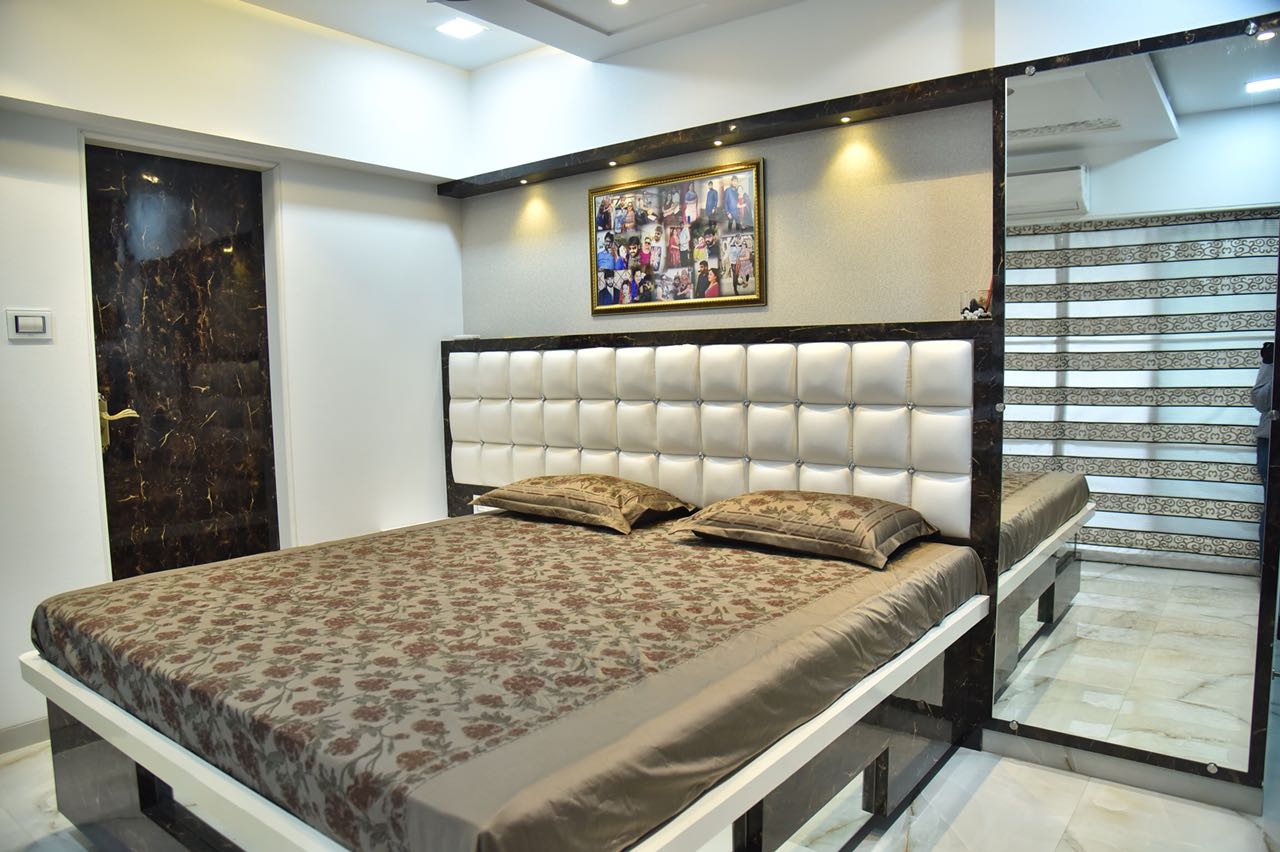 White Themed Master Bedroom With Low-Floor Wooden Bed and White Leather Headrest by Chirag Sunil Bhandari Bedroom Modern | Interior Design Photos & Ideas