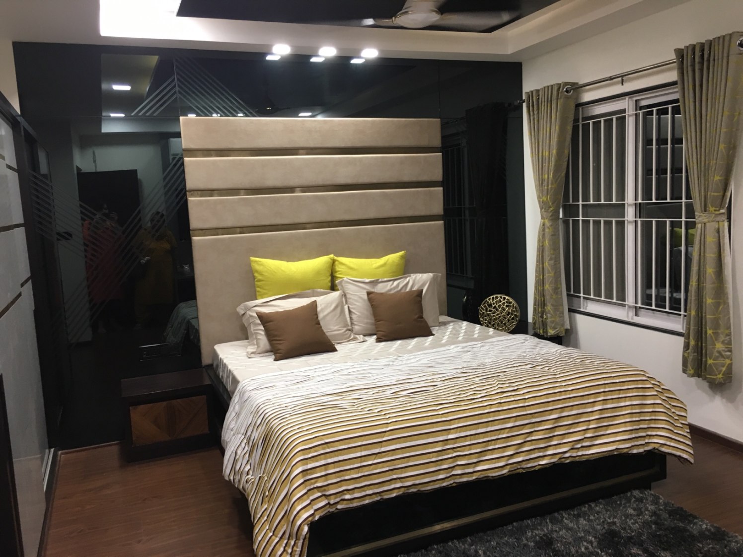 Low Rise Wooden Bed And Beige Cushioned Head Cover by Dhwani Patel Bedroom Contemporary | Interior Design Photos & Ideas