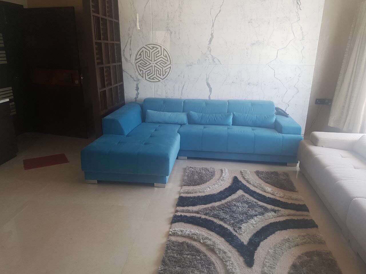 Blue Sectional Sofa And White Marble Wall by Dhwani Patel Living-room Contemporary | Interior Design Photos & Ideas