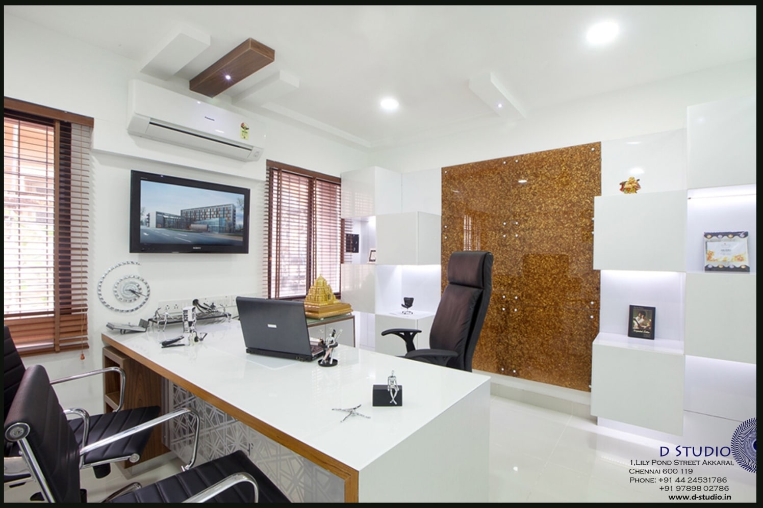 White glossy office with decorative golden Wall panel and Black upholstered swivel chairs by Sarath Sasi P Modern | Interior Design Photos & Ideas