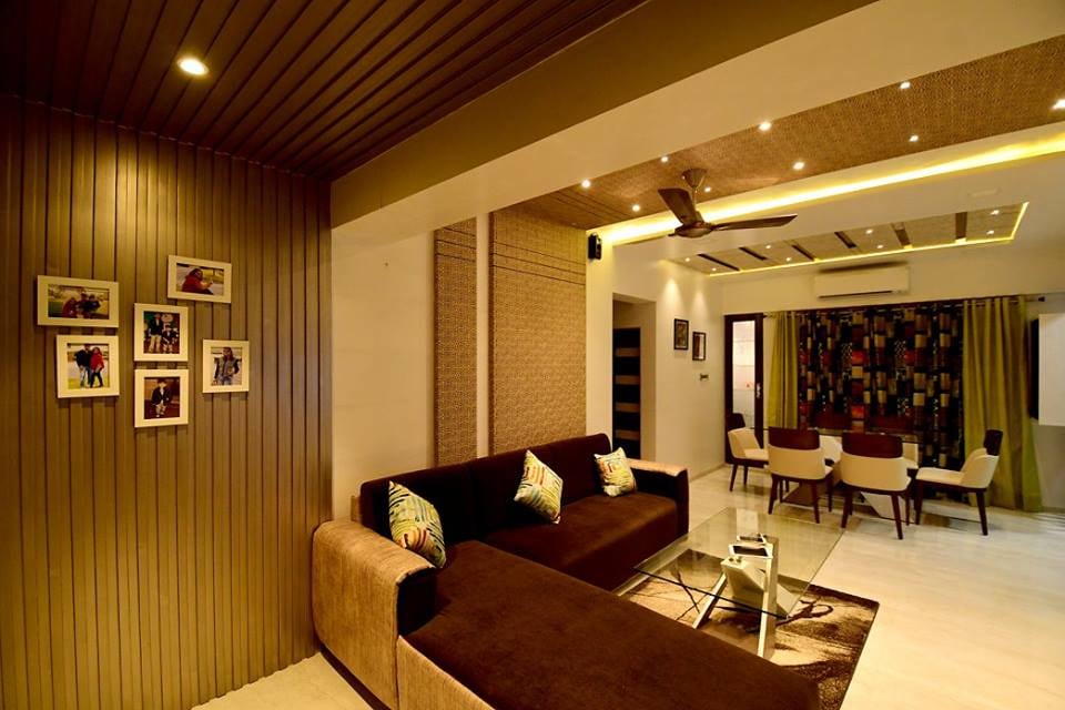 L-Shaped Brown Sofa With Glass Center Table by Monika Bodkhe Living-room Contemporary | Interior Design Photos & Ideas