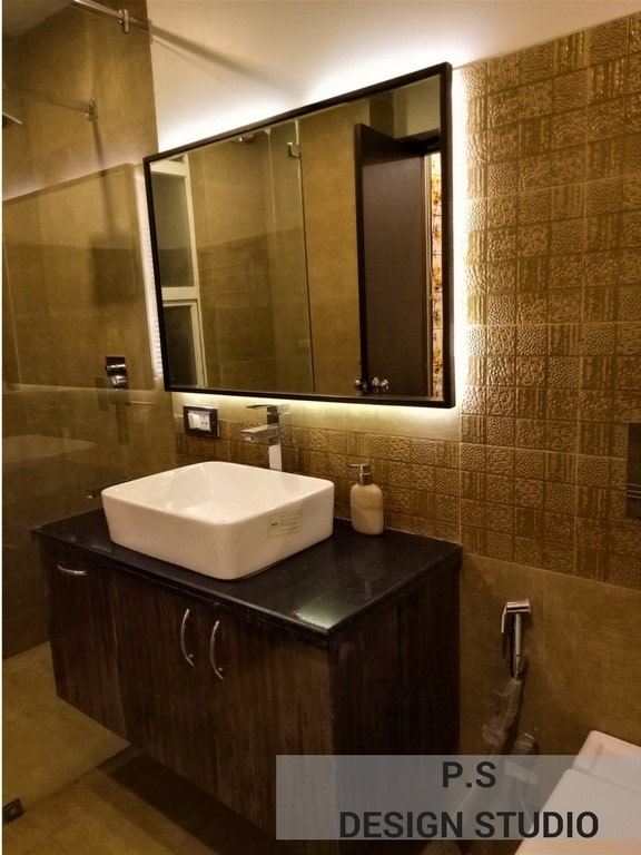 Pale Shade Wash Basin And Wooden Cabinets In Bathroom by ...