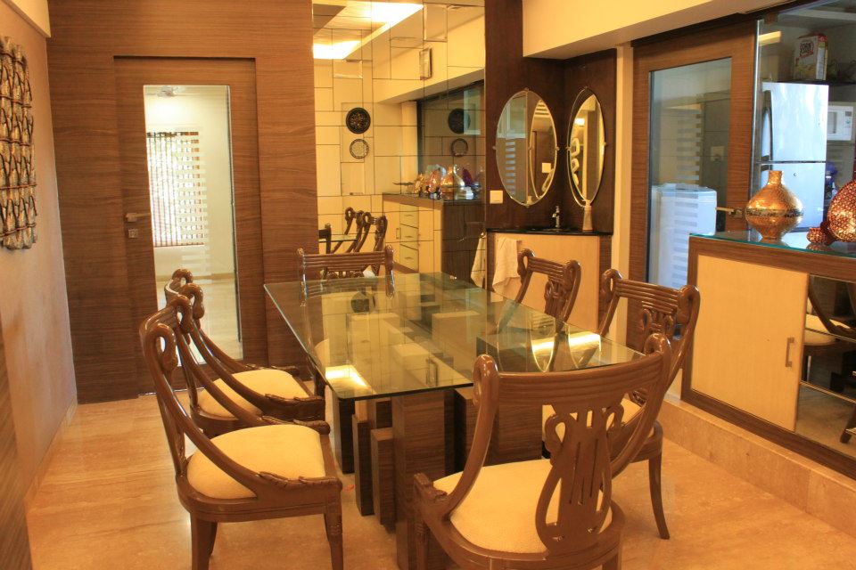 Beige Cushioned Chairs And Glass Top Wooden Table by Sagar Shah Dining-room Traditional | Interior Design Photos & Ideas
