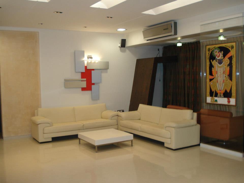 Beige Leather Sofas With White Wooden Table by Sagar Shah Living-room Contemporary | Interior Design Photos & Ideas