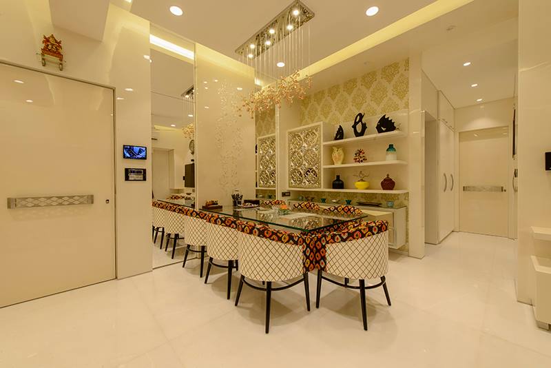 Floral Printed Tub Chairs With Glass Top Table by Sagar Shah Dining-room Minimalistic | Interior Design Photos & Ideas