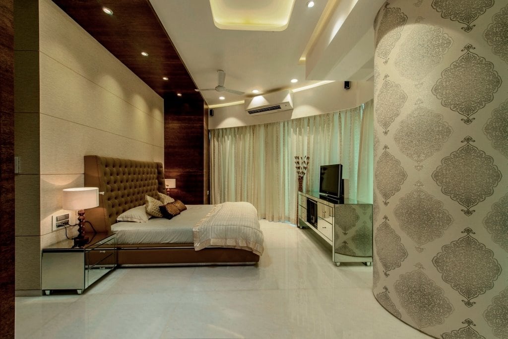 Low Rise Wooden Bed With Mustard Cushioned Head Cover And Printed Wall by Sagar Shah Bedroom Contemporary | Interior Design Photos & Ideas