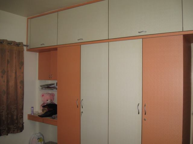 Orange And White Wood Sliding Cupboard by color's interio Bedroom Modern | Interior Design Photos & Ideas