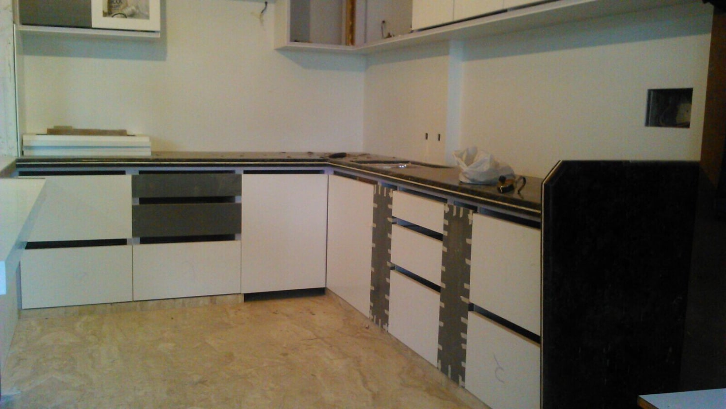 L shape kitchen with marble flooring by kavita.dhotre Modular-kitchen Minimalistic | Interior Design Photos & Ideas