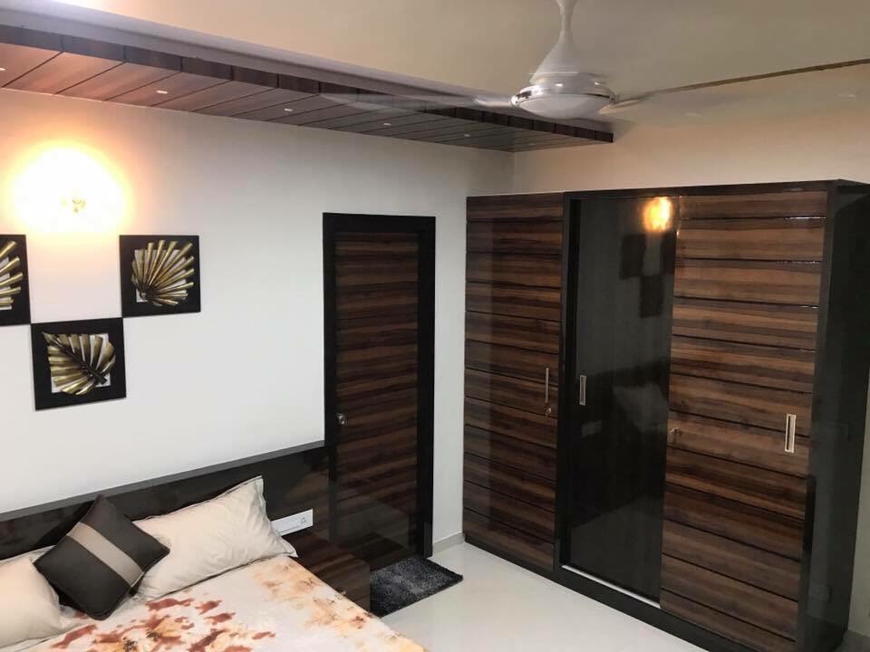 Wooden Wardrobe With Glass Door In Bedroom by Jaldeep patel Bedroom Contemporary | Interior Design Photos & Ideas