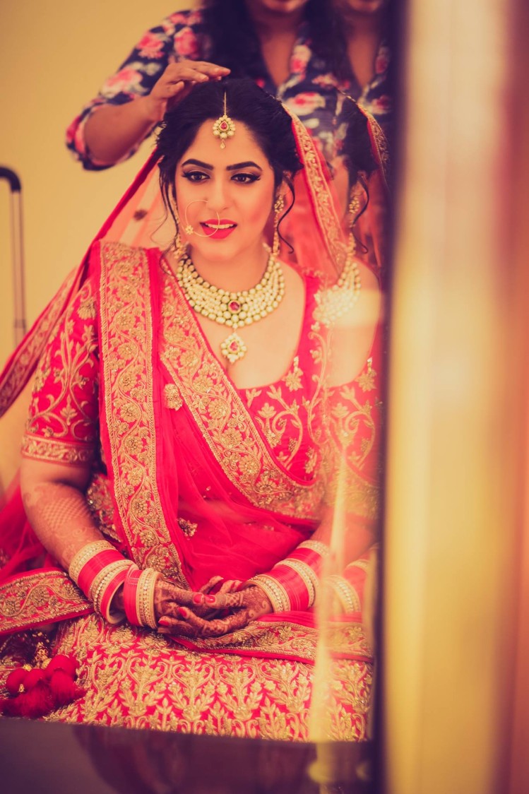 Red and gold motifs by Shruti Sharma Bridal-makeup | Weddings Photos & Ideas