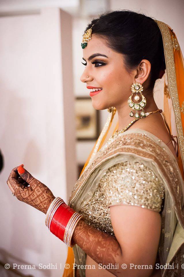 Smiling bride by Shruti Sharma Bridal-makeup | Weddings Photos & Ideas