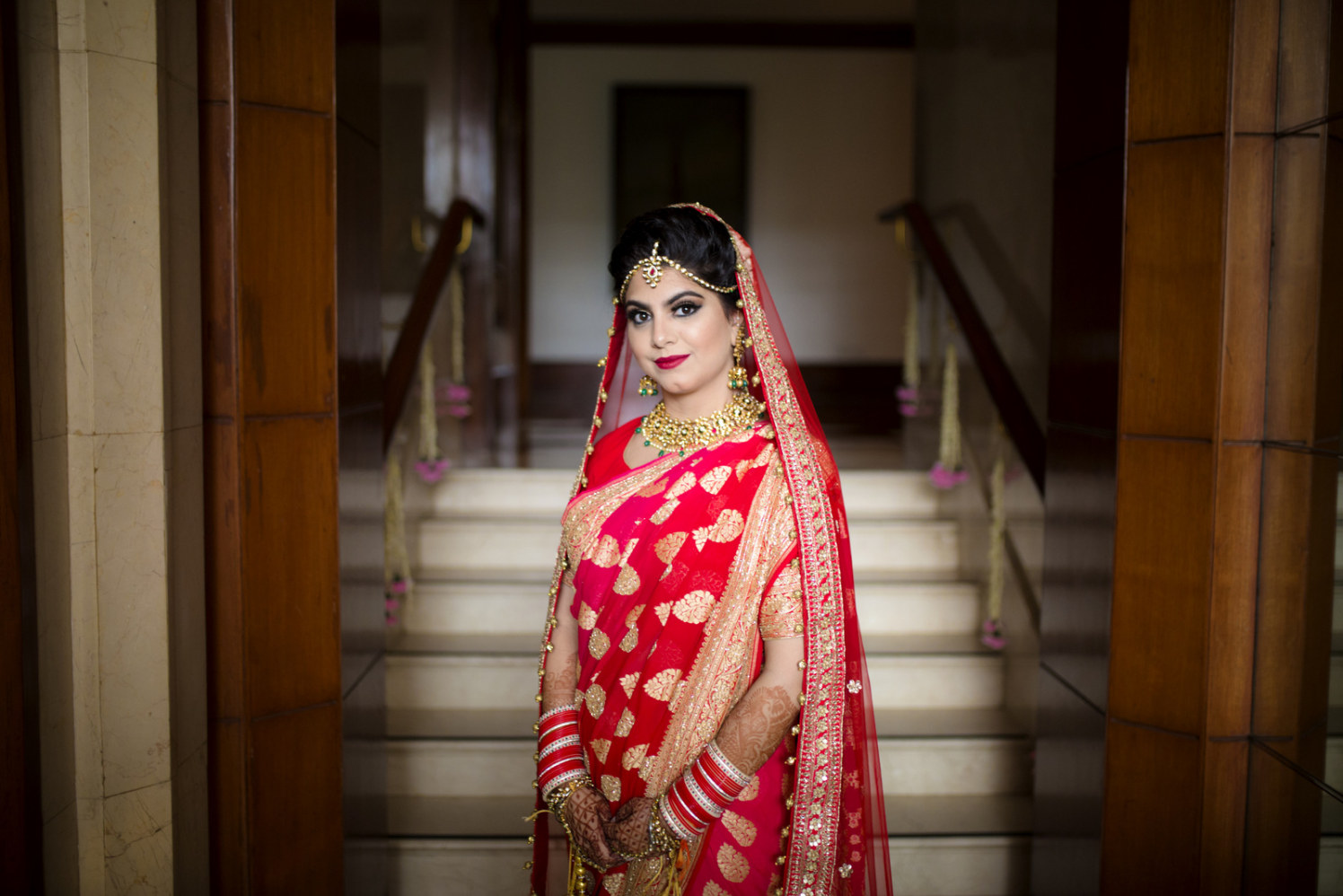 The Bride Looking Stunning In Crimson Red Lehenga With Golden Embroidery by Arpit Gulati Wedding-photography Bridal-jewellery-and-accessories | Weddings Photos & Ideas