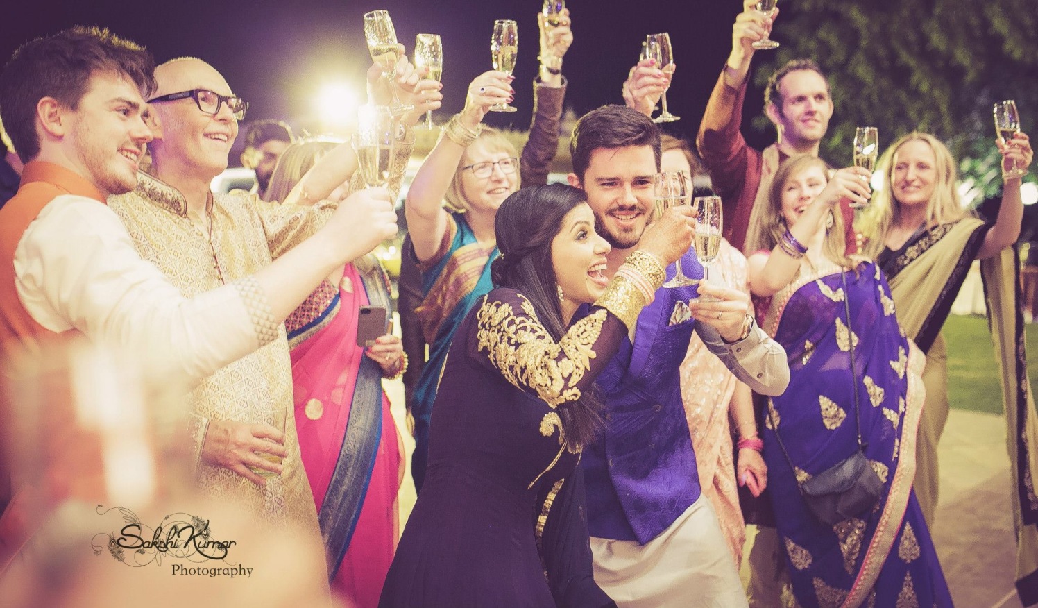 Family Cheers To The Charming Couple by Sakshi Kumar Wedding-photography | Weddings Photos & Ideas