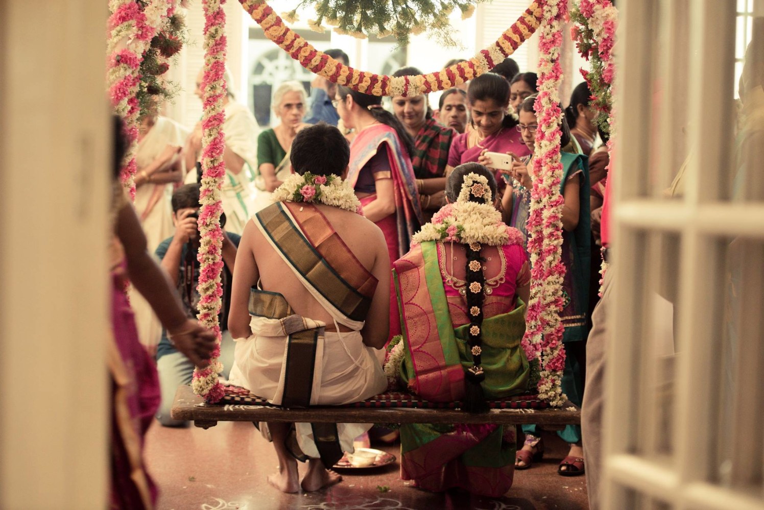 Flower adorned swing by Click n' Cherish Wedding-photography | Weddings Photos & Ideas