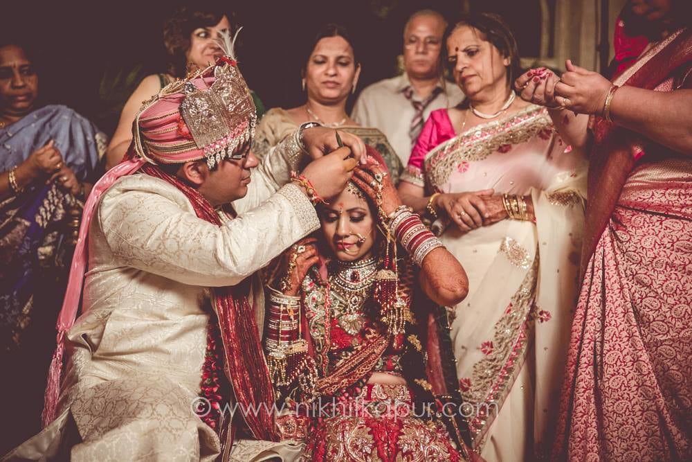 Candid couple at the ceremony by Nikhil Kapur Photography Wedding-photography | Weddings Photos & Ideas