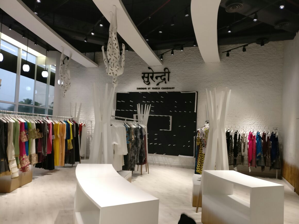 White Themed Showroom Reception by Abhinav Jain | Interior Design Photos & Ideas