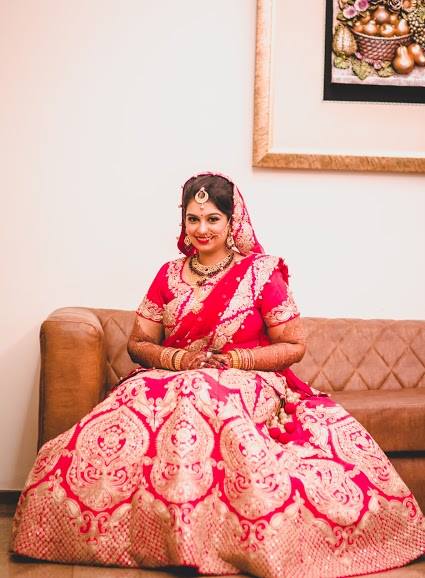 Charismatic Red lehenga with intricate gold by Ayushi Tayal Wedding-photography | Weddings Photos & Ideas