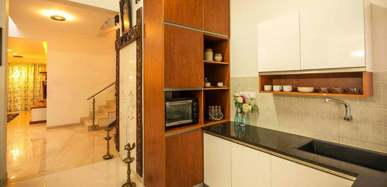 A modern L shaped modular kitchen by Interior Elements Modular-kitchen | Interior Design Photos & Ideas