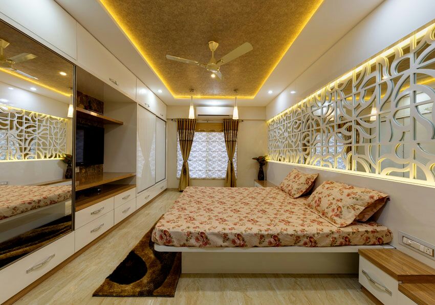Wooden flooring bedroom with false ceiling by Hemangi Chaudhari-pawar Bedroom Contemporary | Interior Design Photos & Ideas