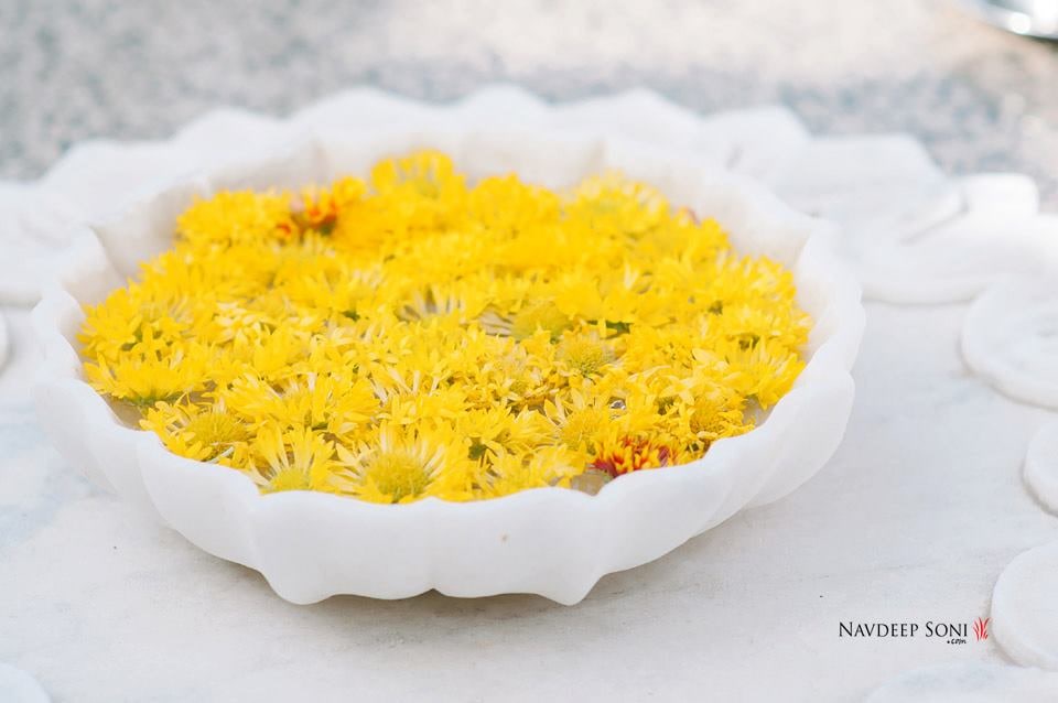 Yellow Marigold Flowers Floating In A White Centerpiece by Navdeep Soni Wedding-decor | Weddings Photos & Ideas