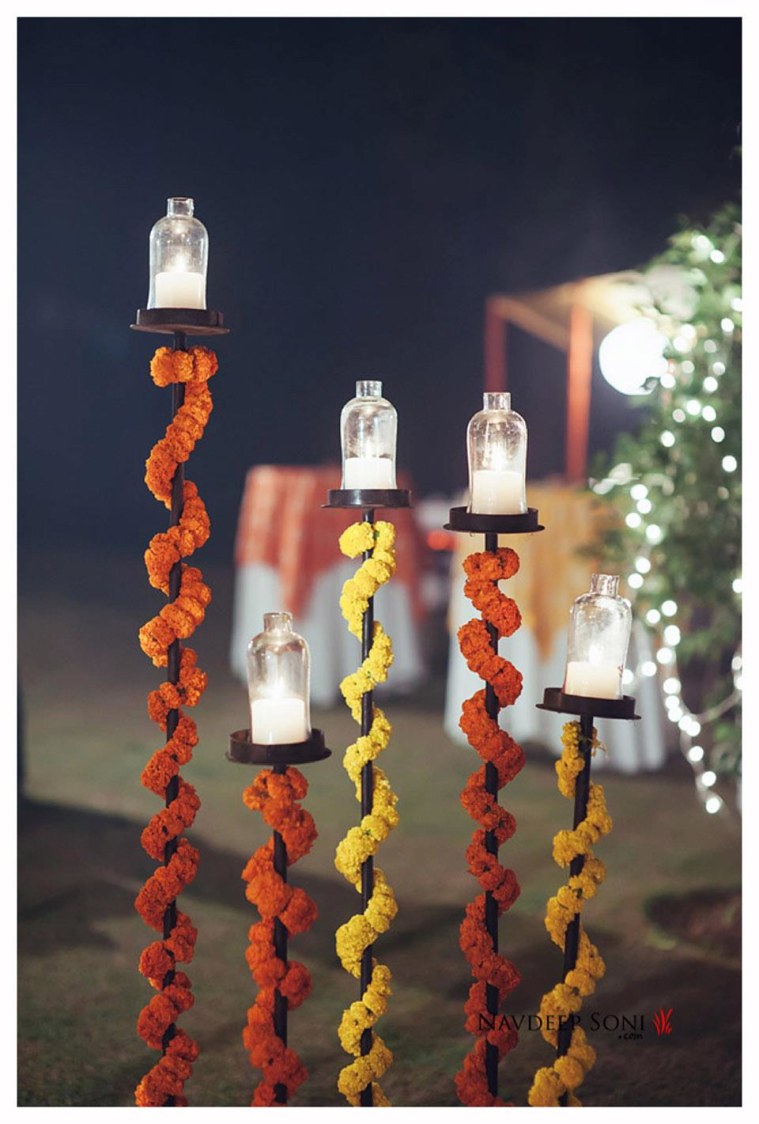 Stylized Candle-Stands Spiraled With Garlands by Navdeep Soni Photography Wedding-photography | Weddings Photos & Ideas