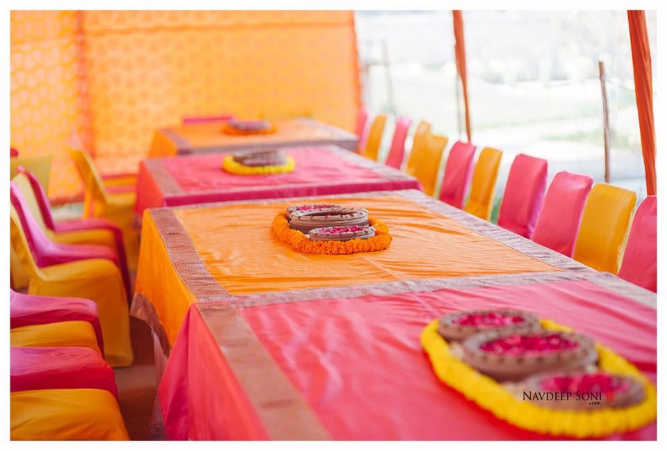 Saffron And Pink Themed Seating Wedding Decor With Marigold And Rose Petals Center Pieces In Center by Navdeep Soni Wedding-decor | Weddings Photos & Ideas