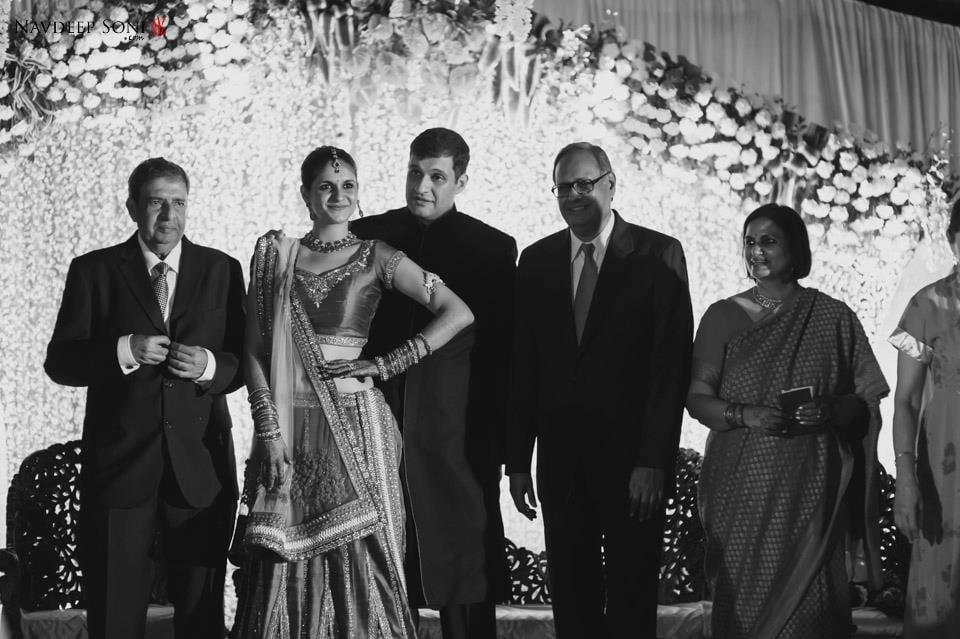 Black And White Shot Of Bride And Groom Striking A Pose With Wedding Guests by Navdeep Soni Wedding-photography | Weddings Photos & Ideas