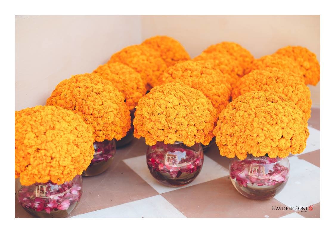 Yellow Marigold Flowers In Glass Containers For Traditional Wedding Decor by Navdeep Soni Wedding-decor | Weddings Photos & Ideas