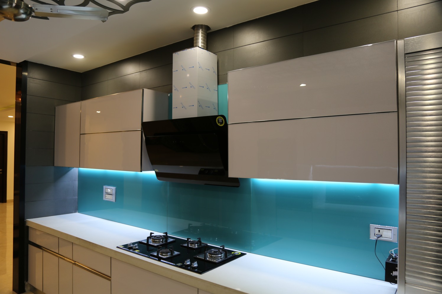 Modular Blue Kitchen With Glossy Cabinets by Aishwary interiors